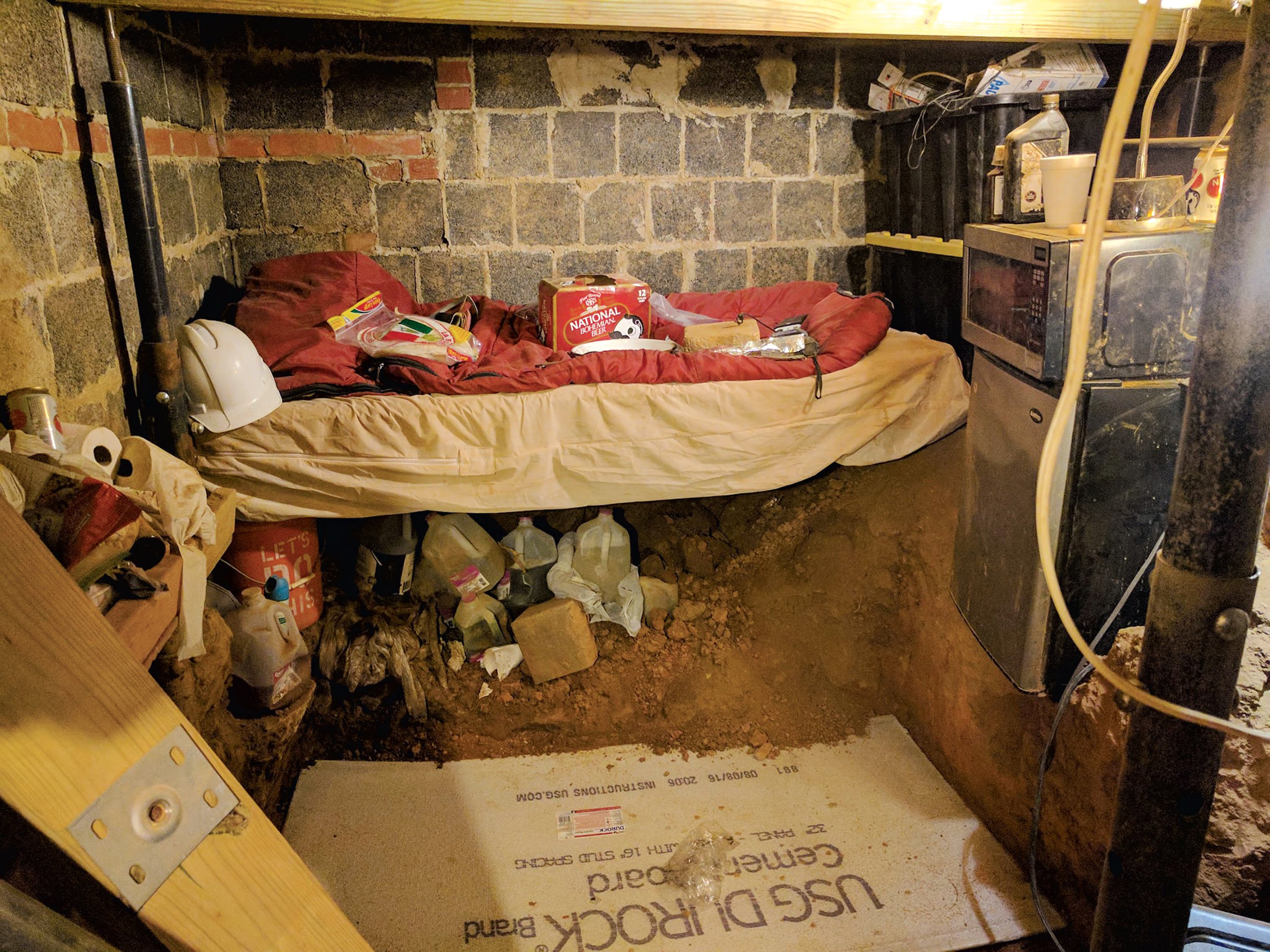 Askia would dig in the fallout shelter for days a time. His bedroom had a microwave and mini-fridge. Daniel would throw food down to him. Photograph Courtesy of Montgomery County Circuit Court.