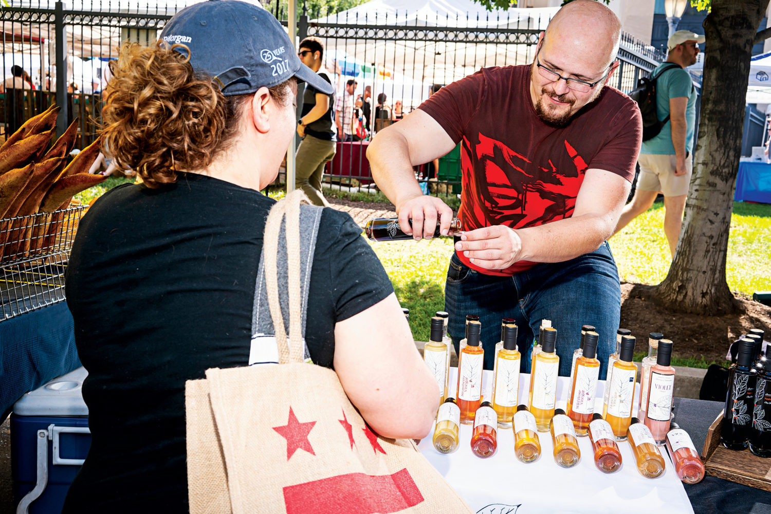 Daniel Liberson of Lindera Farm’s sells vinager and soy sauce at the Dupont Circle Farmers market.