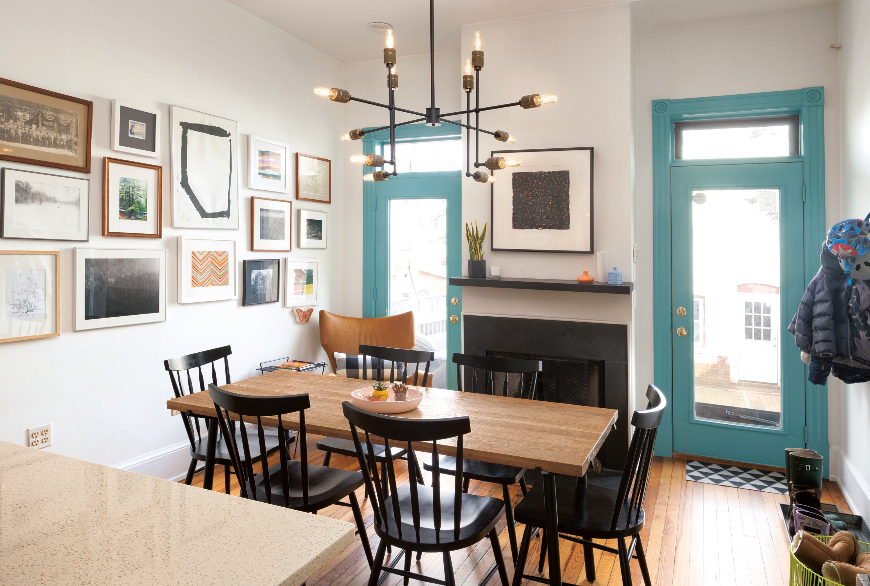 Quick Trick: Painting the original trimwork in the kitchen, a shade of bright aqua helps it stand out and look fresh. Photograph by Jenn Verrier Photography.