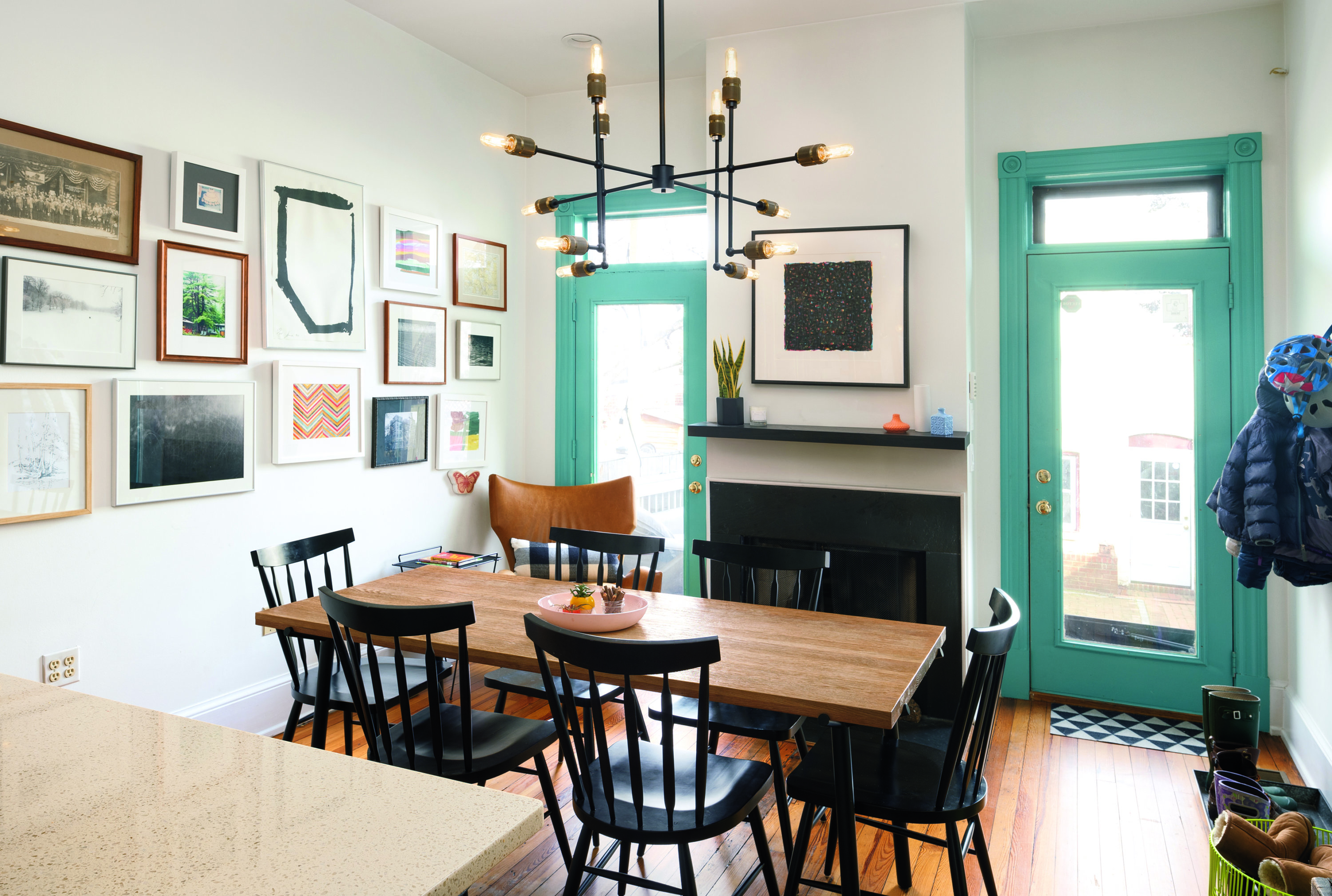 Quick Trick: Painting the original trimwork in the kitchen, a shade of bright aqua helps it stand out and look fresh. Photograph by Jenn Verrier Photography.