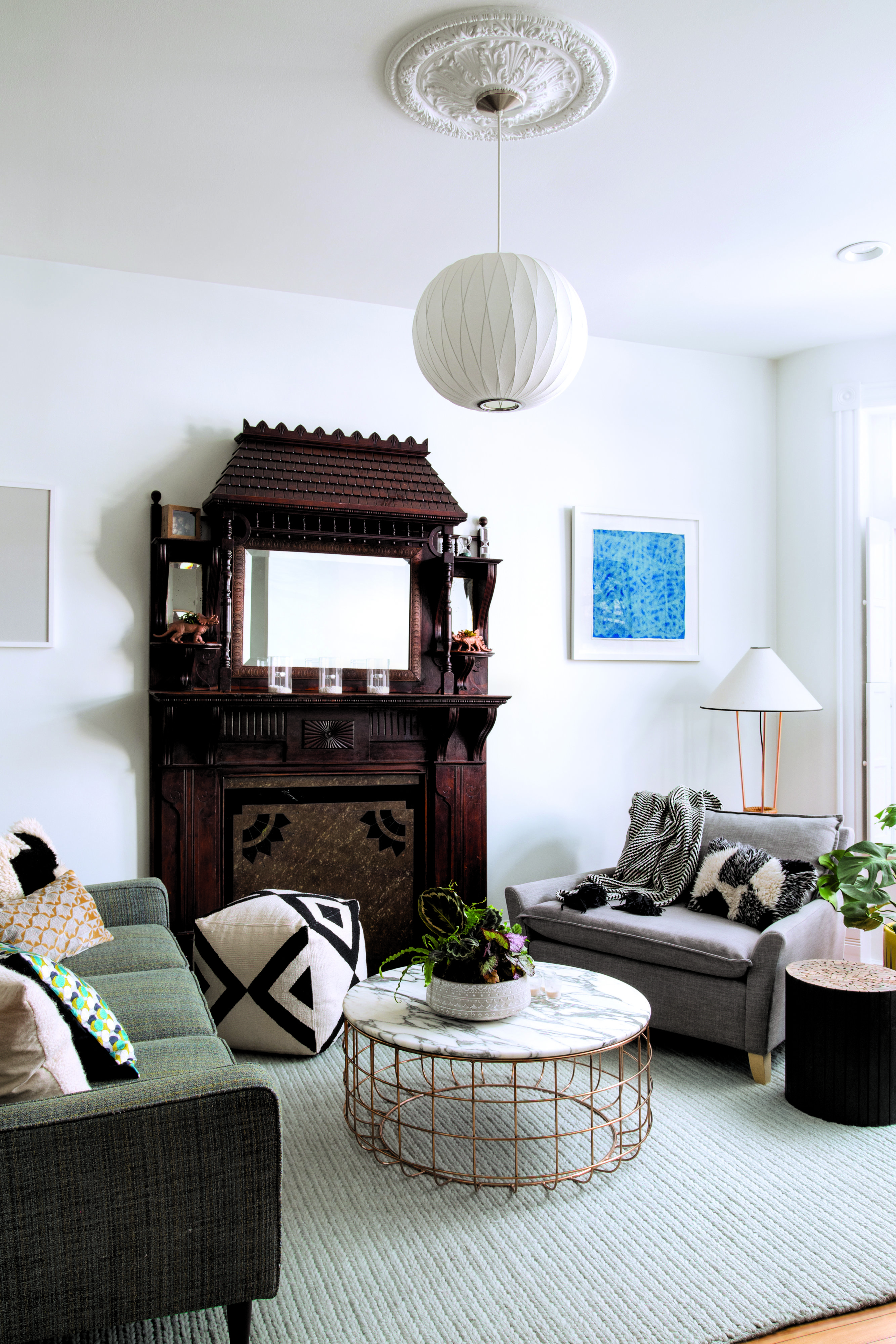 Lanteri_141-11th-5 - Washingtonian Creating contrast: Designer Nicole Lanteri chose clean-lined living-room furniture that doesn’t compete with the intricate 19th-century mantle. Photograph by Jenn Verrier Photography.