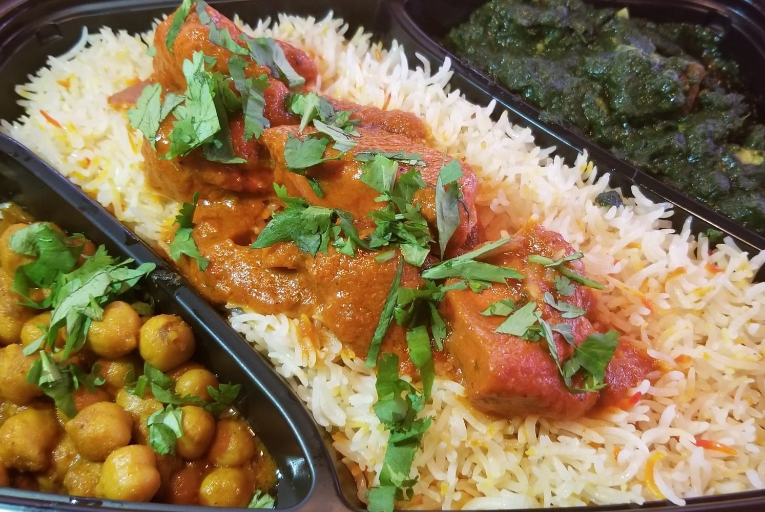Each $11 platter comes with butter chicken and two side dishes. Photo courtesy of Butter Chicken Company.