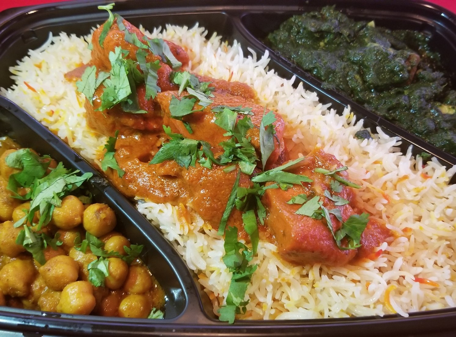 Each $11 platter comes with butter chicken and two side dishes. Photo courtesy of Butter Chicken Company.