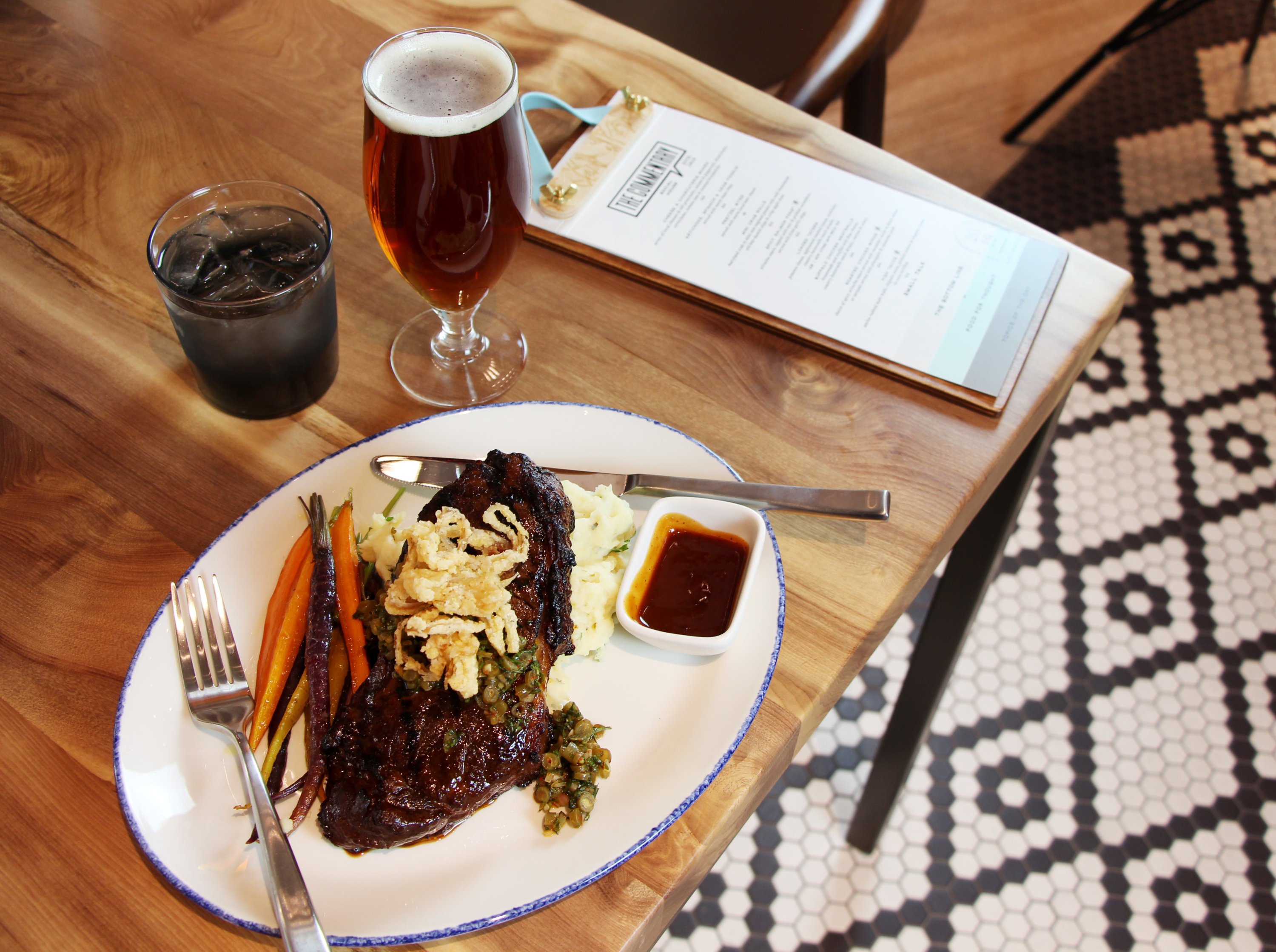 The steak is topped with fried shallots. Photo courtesy of the Commentary Social House.