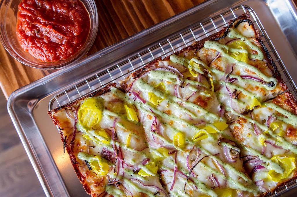 - Washingtonian The Emmy features banana peppers and red onions. Photo courtesy of Emmy Squared.