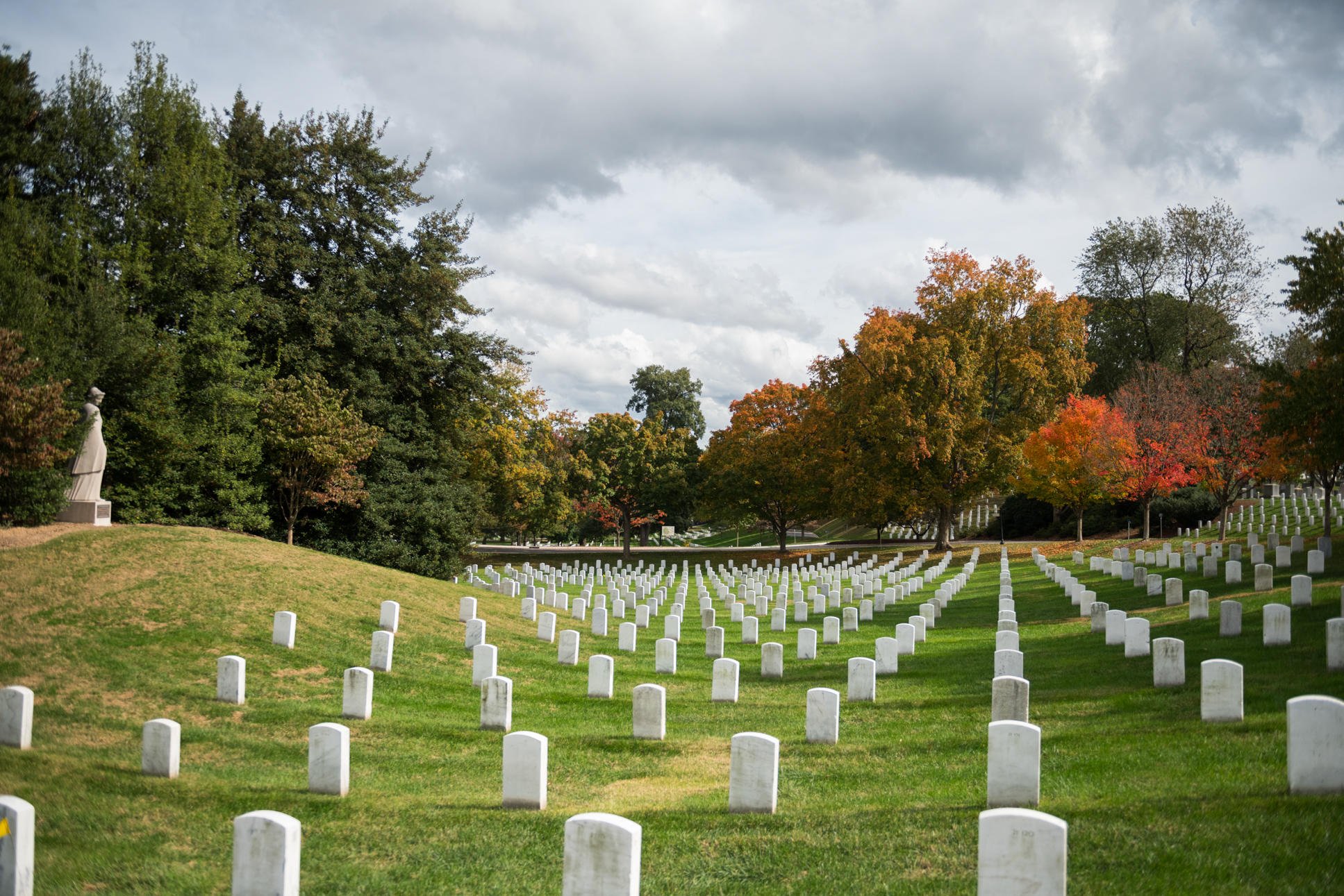 Leaves change color in Section 21 next to the Nurse's Memorial at Arlington National Cemetery, Arlington, Virginia, Oct. 23, 2017. The granite statue of a nurse in uniform, sculptured by Frances Rich, honors the nurses who served in the U.S. armed forces - Washingtonian