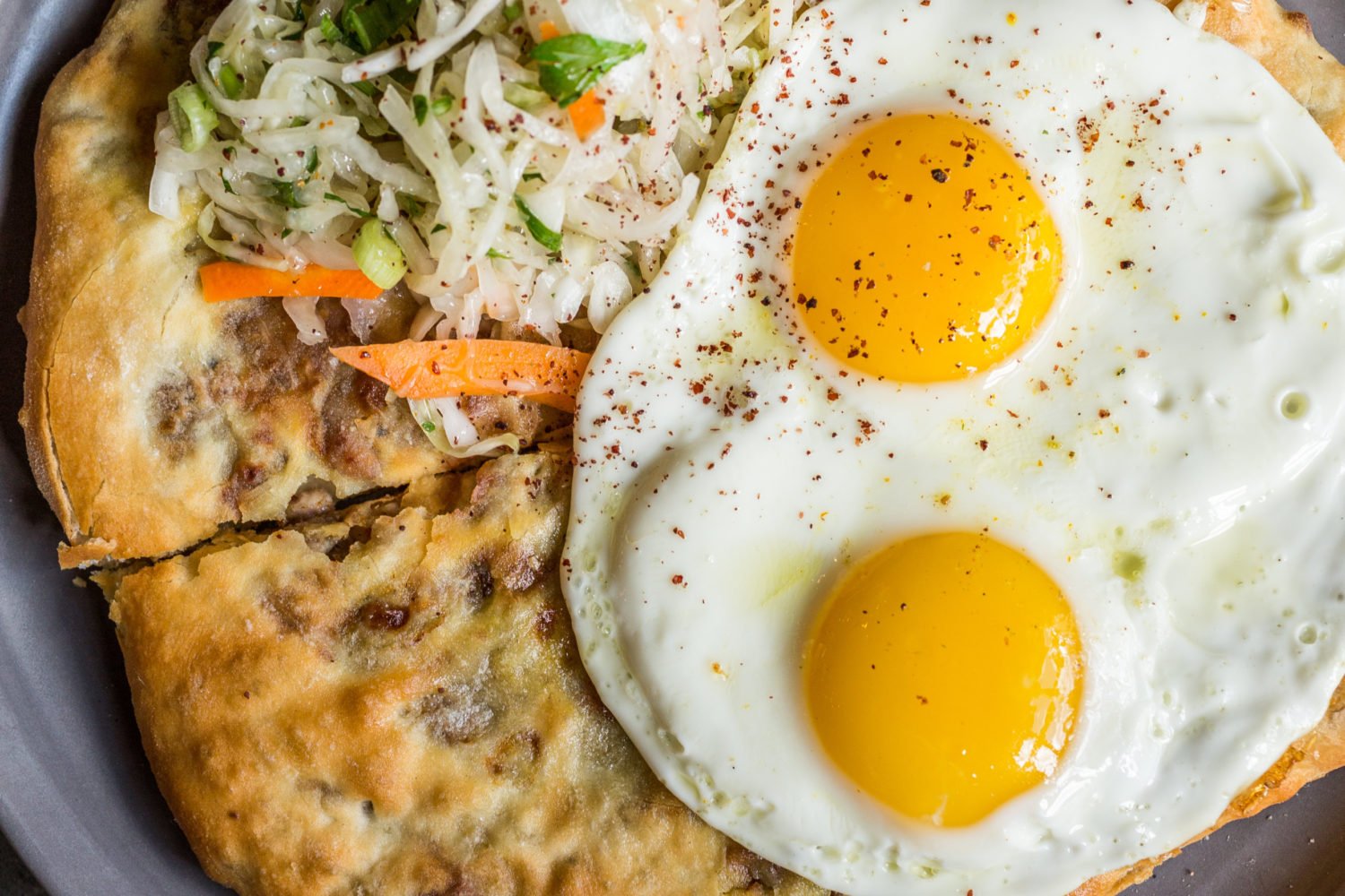 Potato-and-cheese-stuffed khabizgina is topped with an egg at Supra. Photo courtesy of Supra.