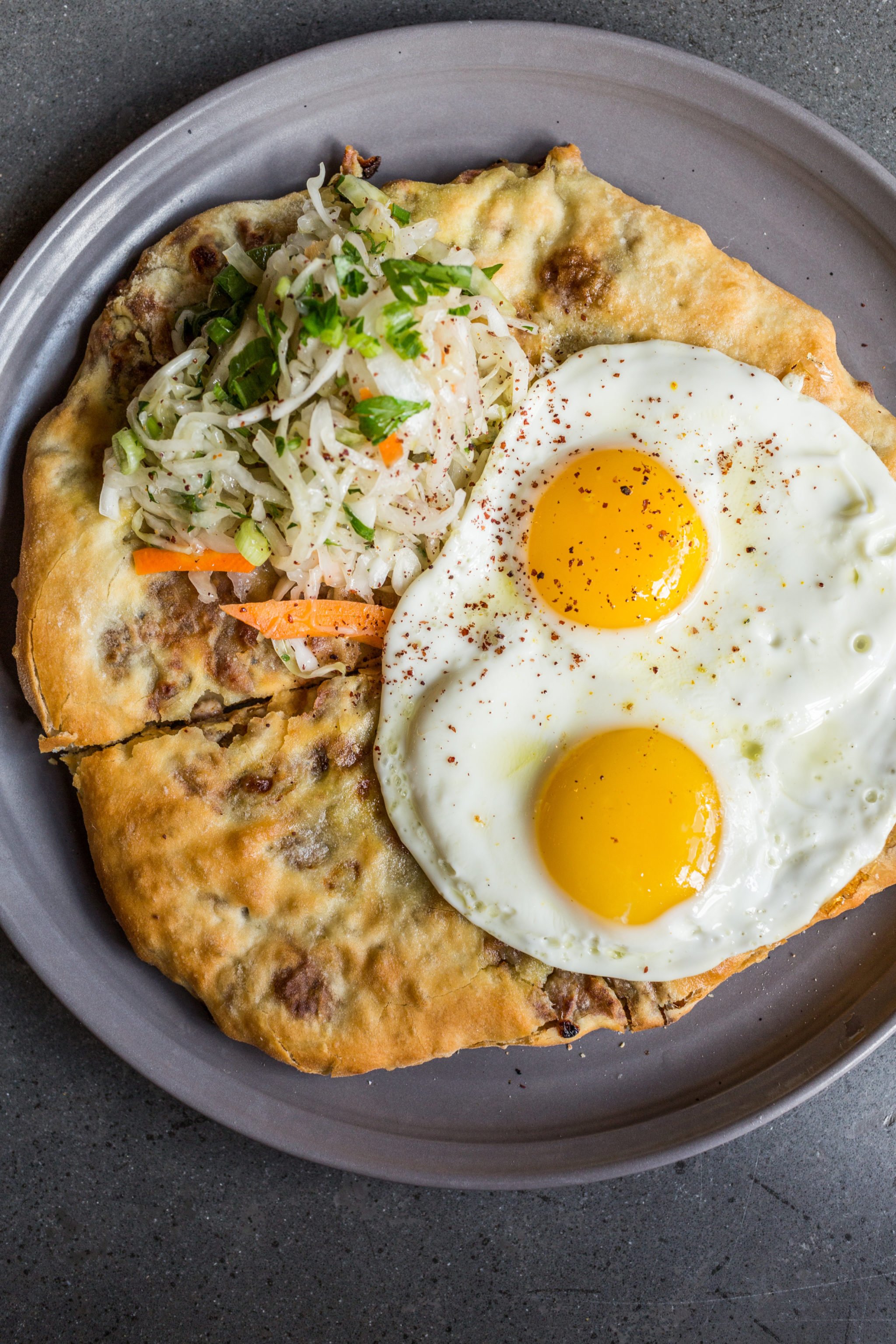 Potato-and-cheese-stuffed khabizgina is topped with an egg at Supra. Photo courtesy of Supra.