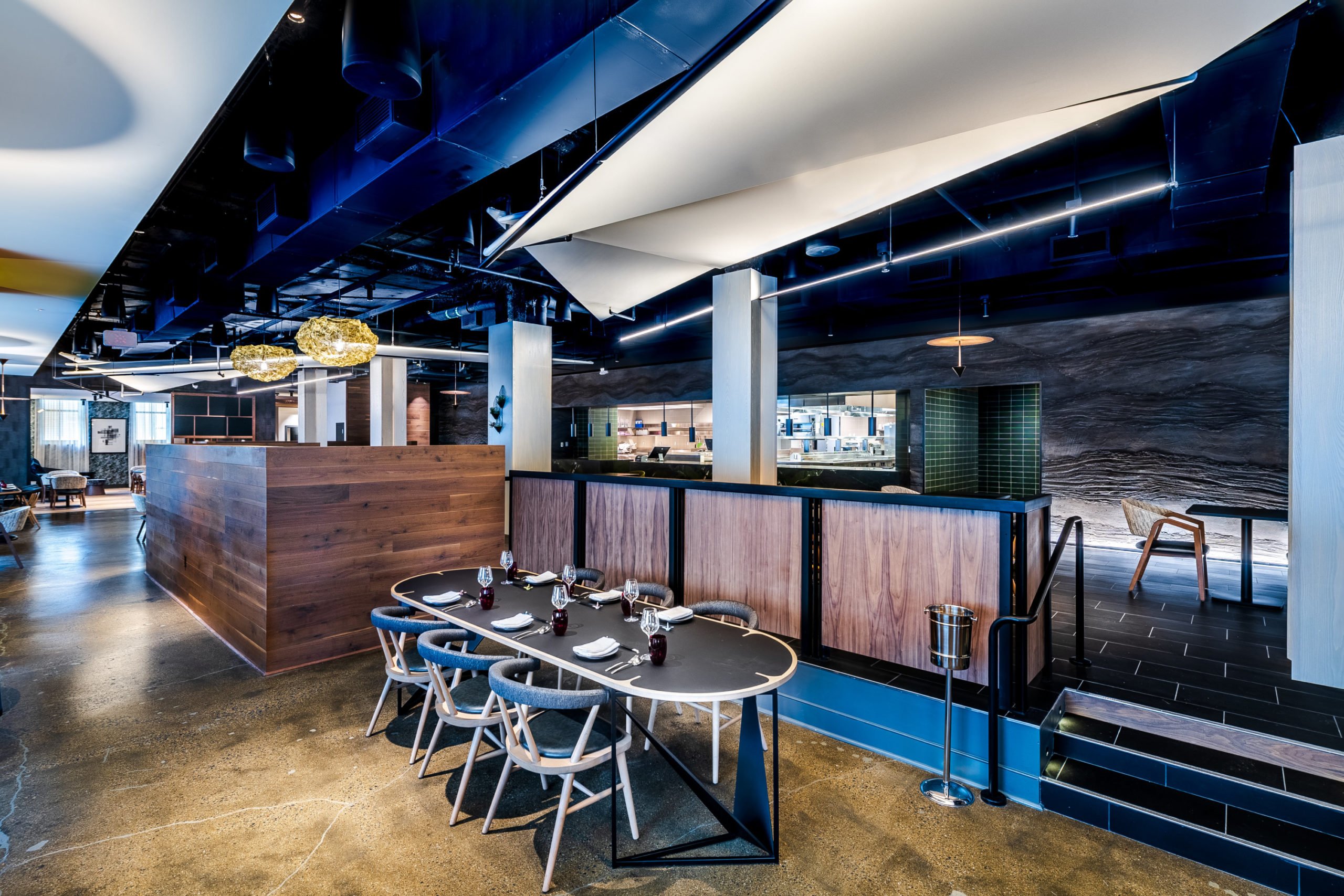 raised dining area & open kitchen - Washingtonian The blue and grey-hued dining room. Photo by Rey Lopez.
