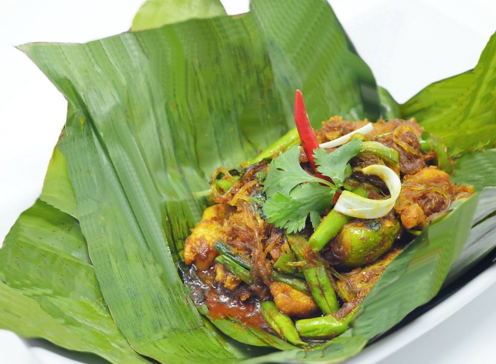 Spicy chicken in banana leaf - Washingtonian