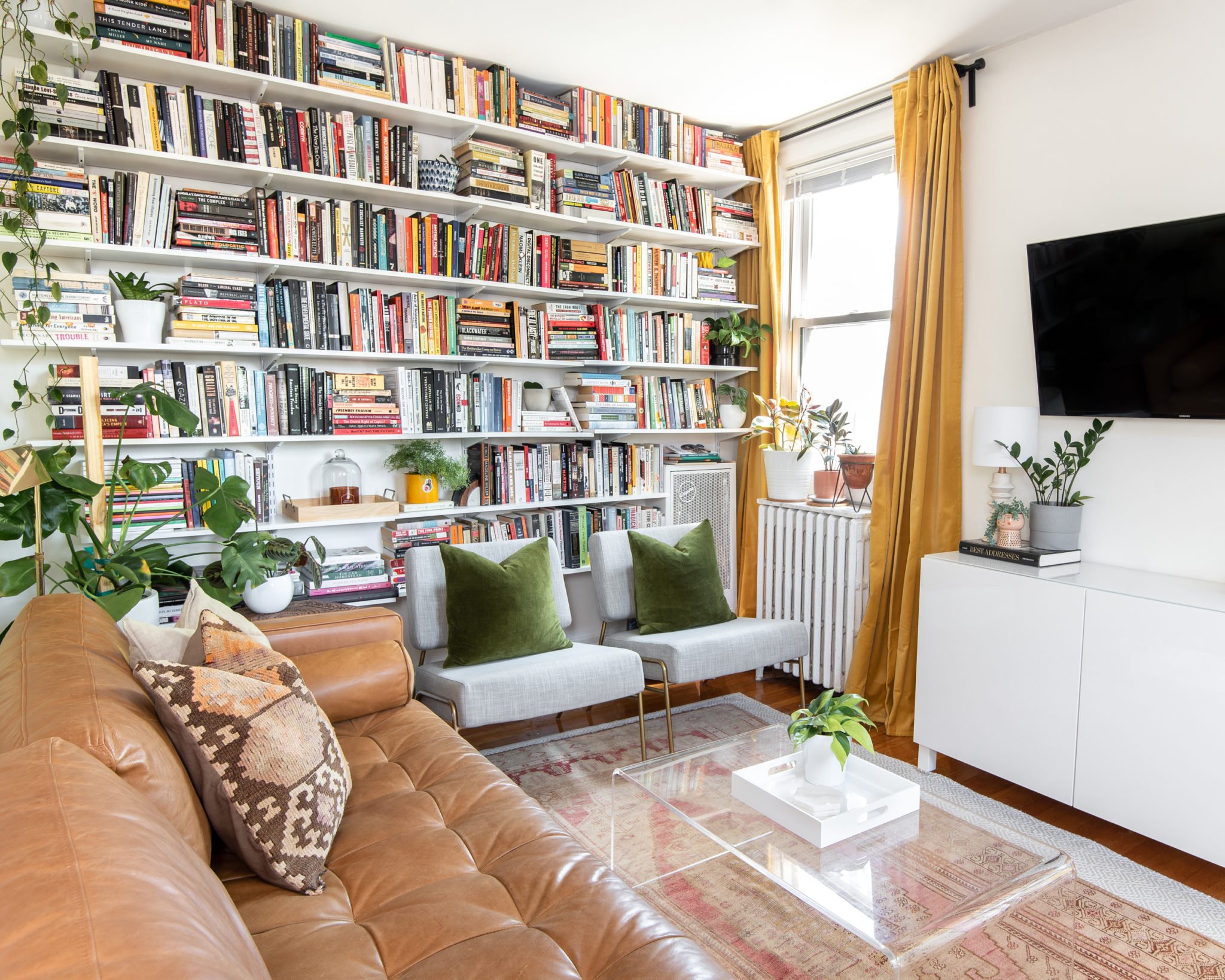 Look Inside My Home: A Park View One-Bedroom With a Floor-to-Ceiling Bookshelf, Statement Wallpaper, and Tons of Plants