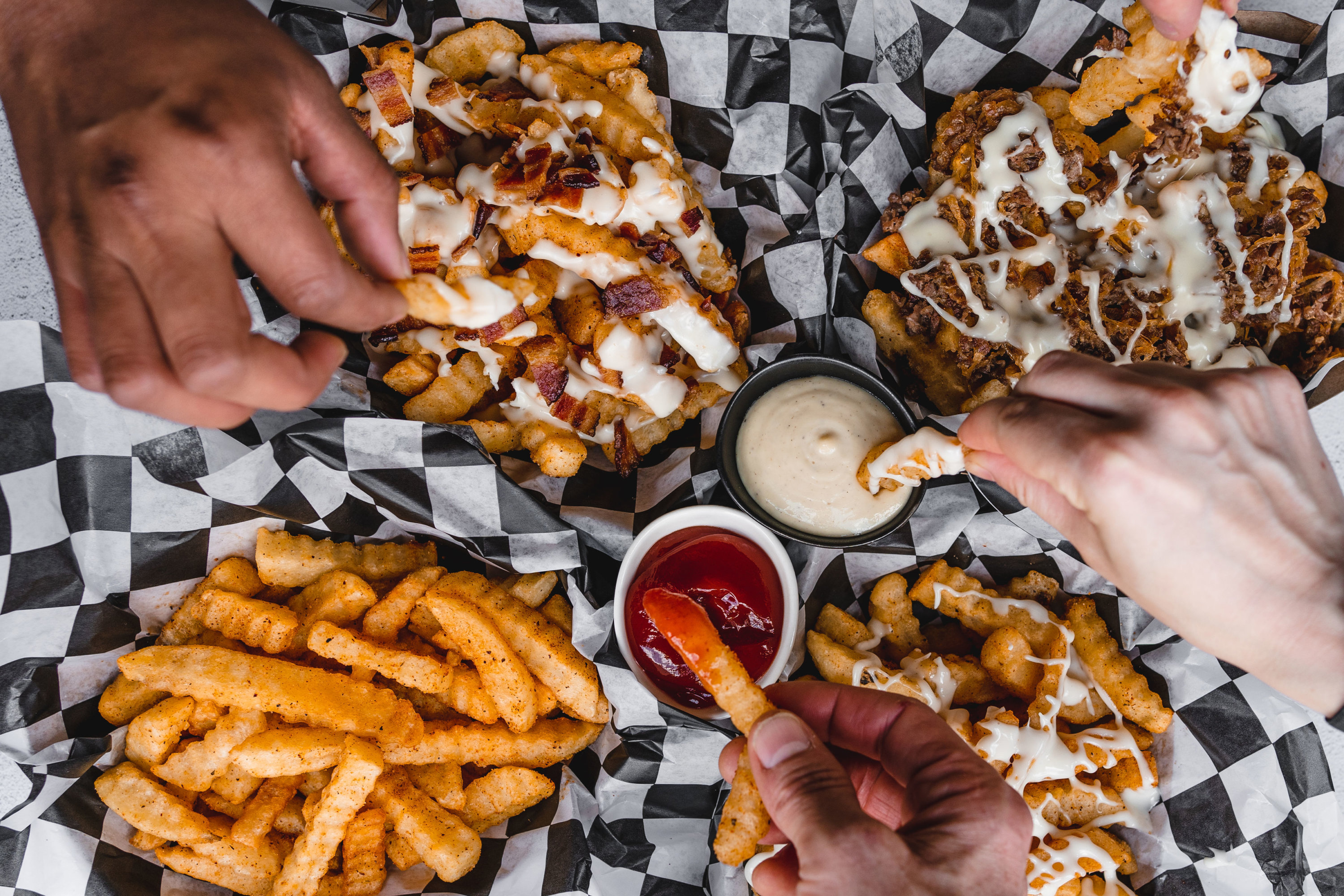 Loaded fries topped with cheese. Photo by Leah Judson.