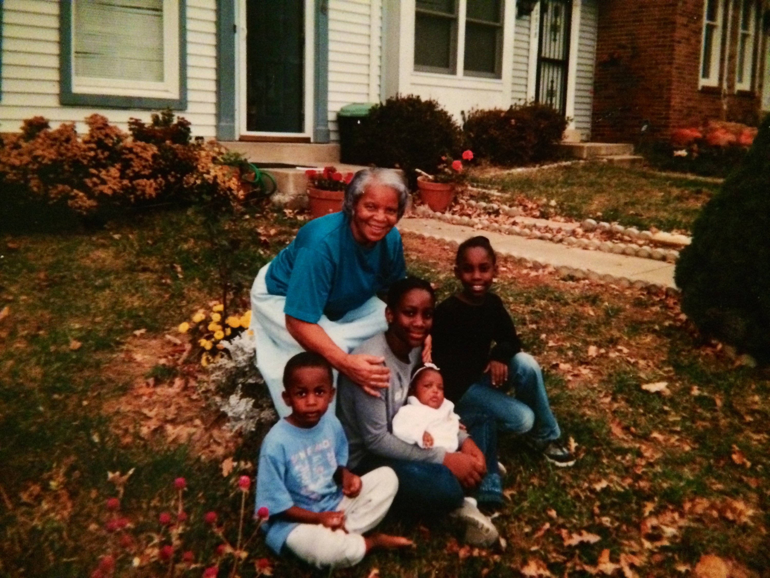 An undated photo of Phillip (holding the baby) with her brother, sisters, and grandmother.