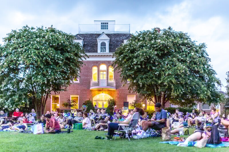 people with mansion in back - Washingtonian