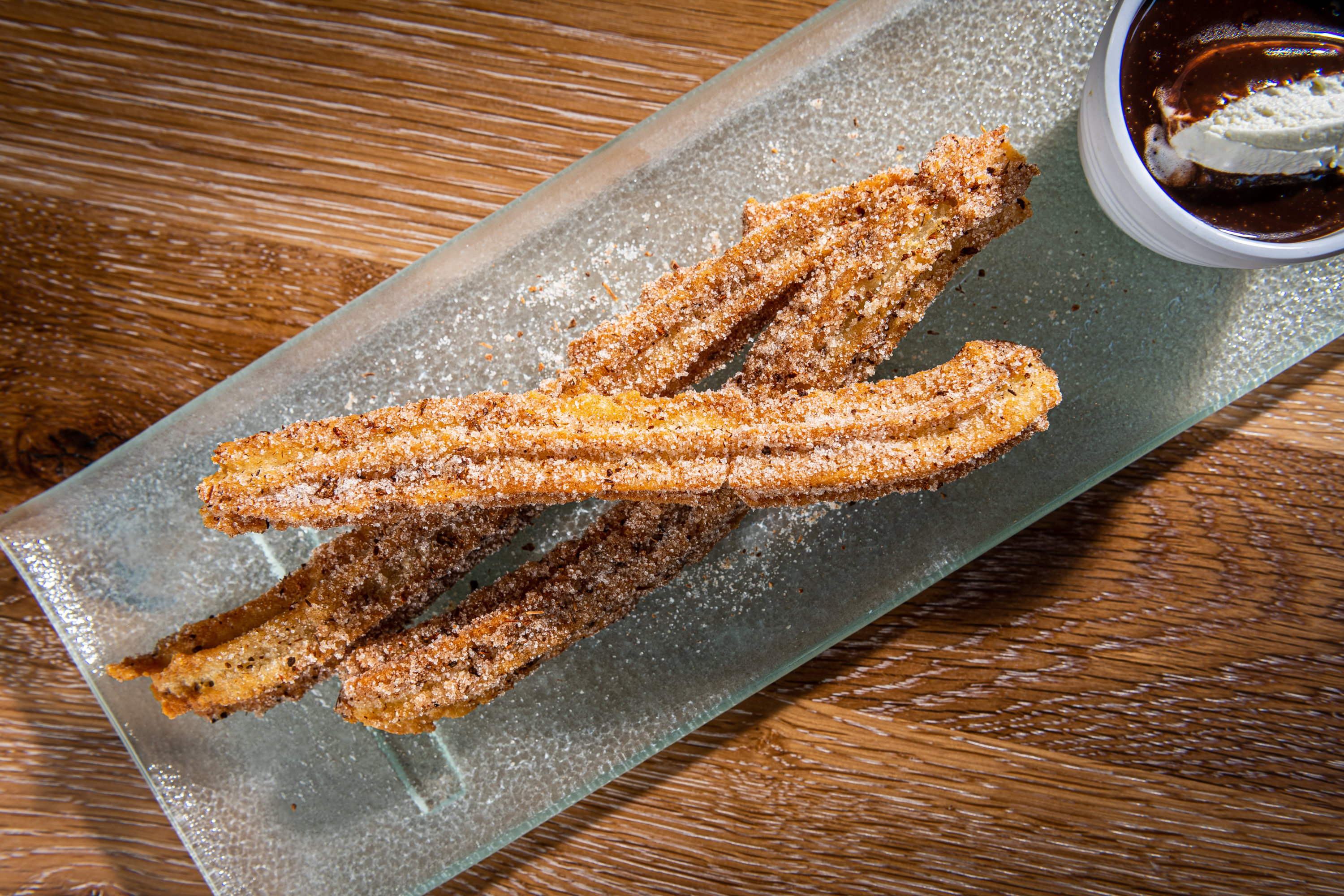 Flan and churros are on the dessert menu. Photo by Rey Lopez.