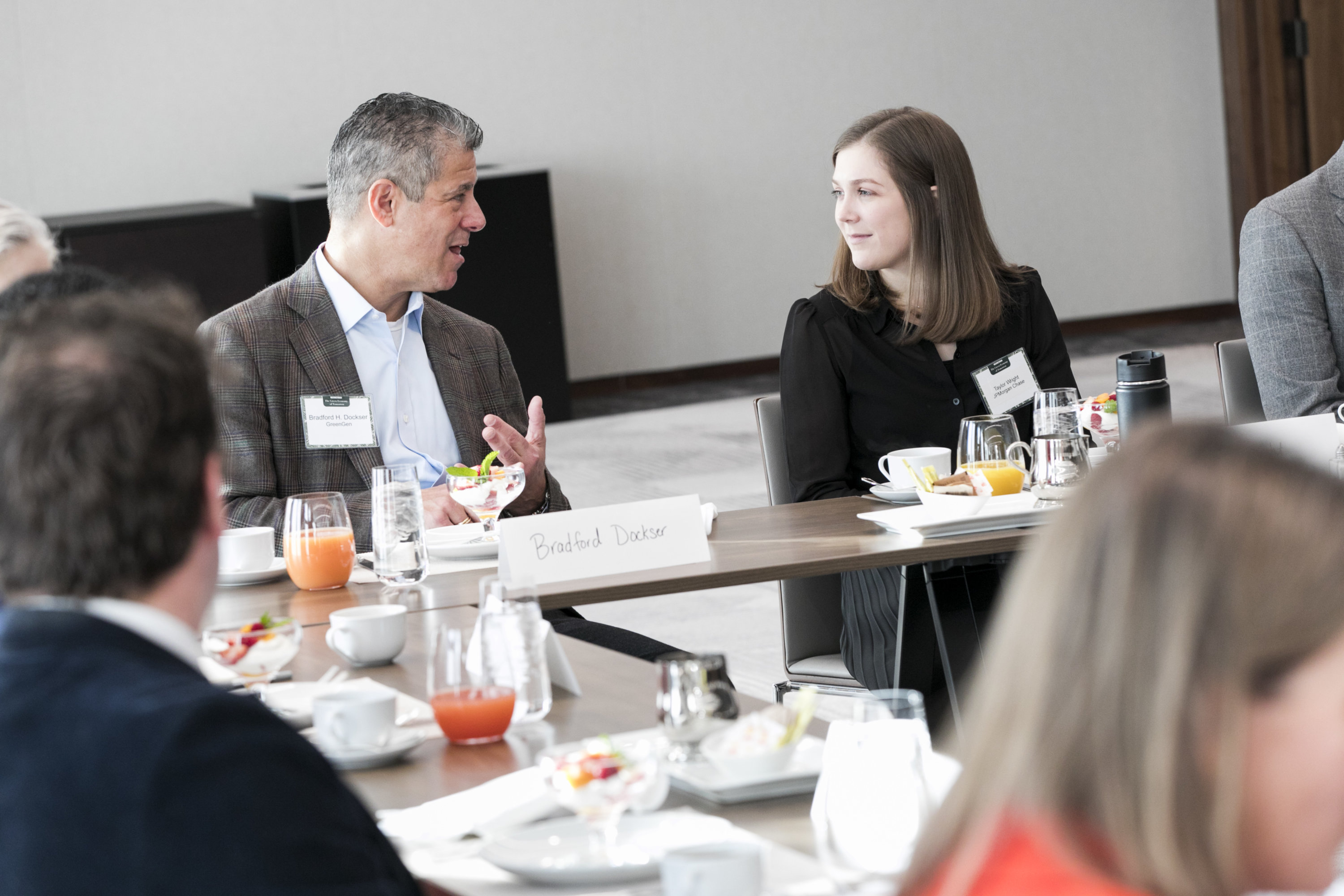 People conversing at a table