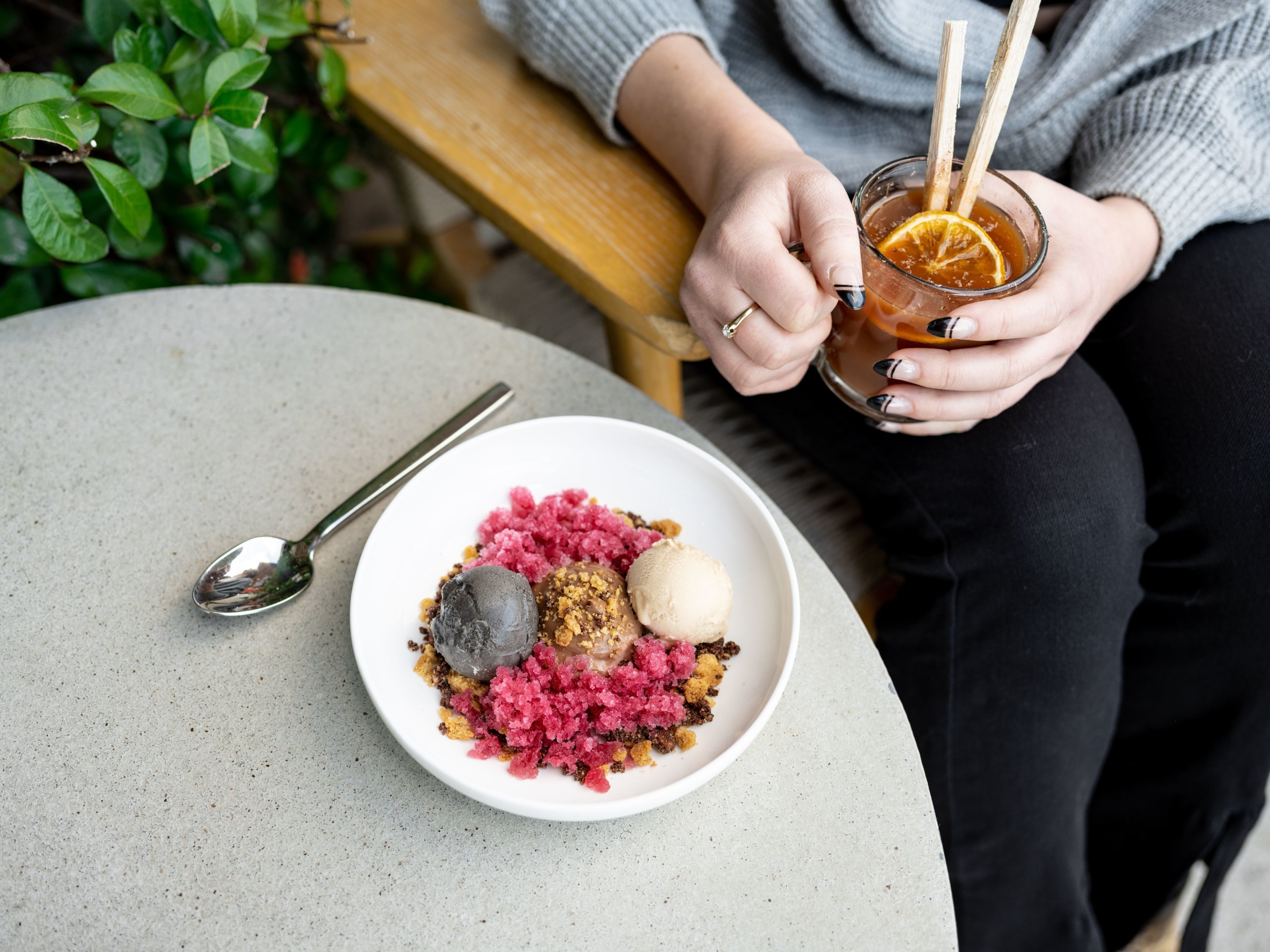 A riff on a sundae is made with black sesame ice cream and peanut sorbet on pomegranate ice. Photo by Leah Judson. 