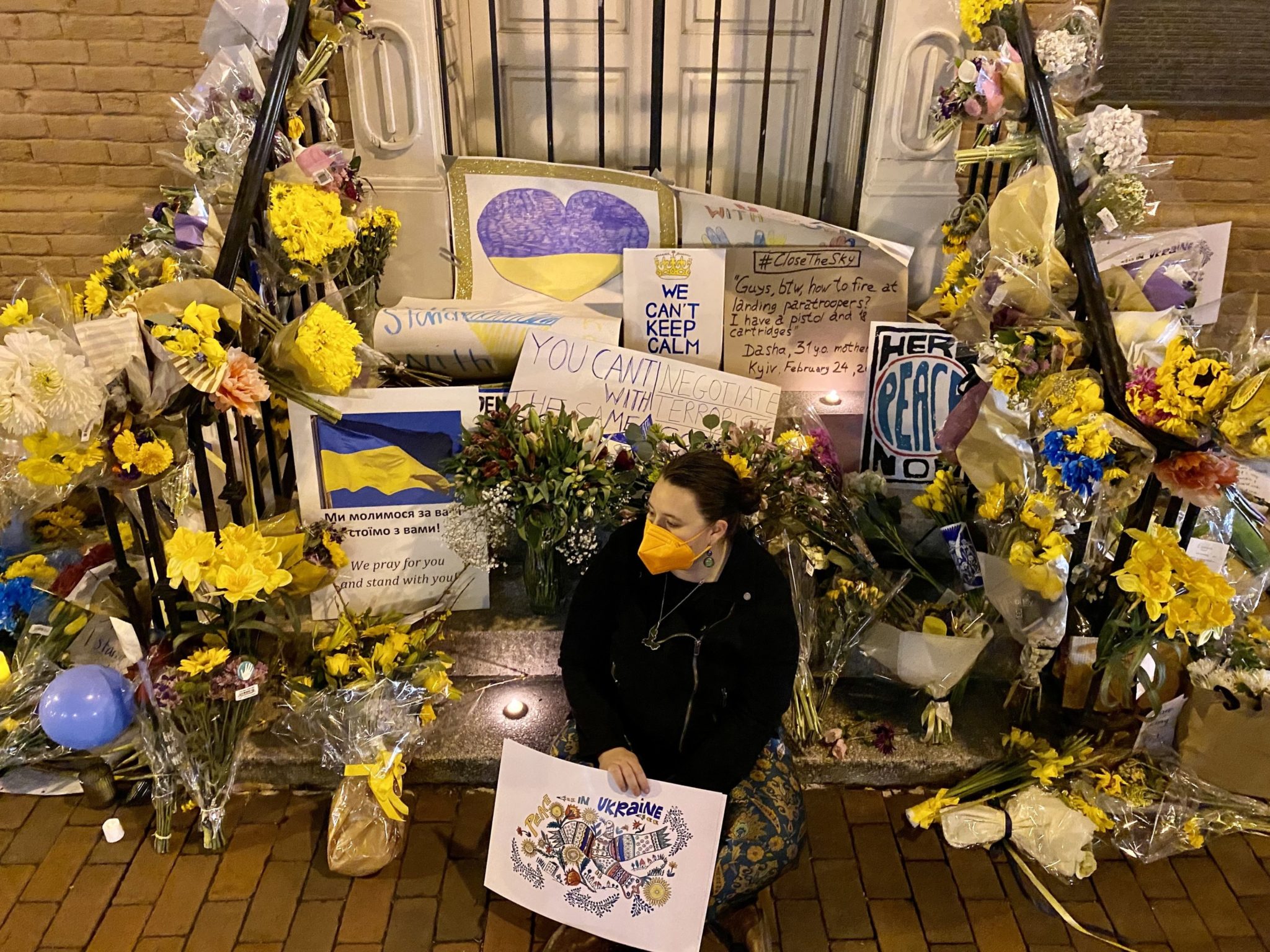 PHOTOS: Signs and Flowers Outside the Ukrainian Embassy