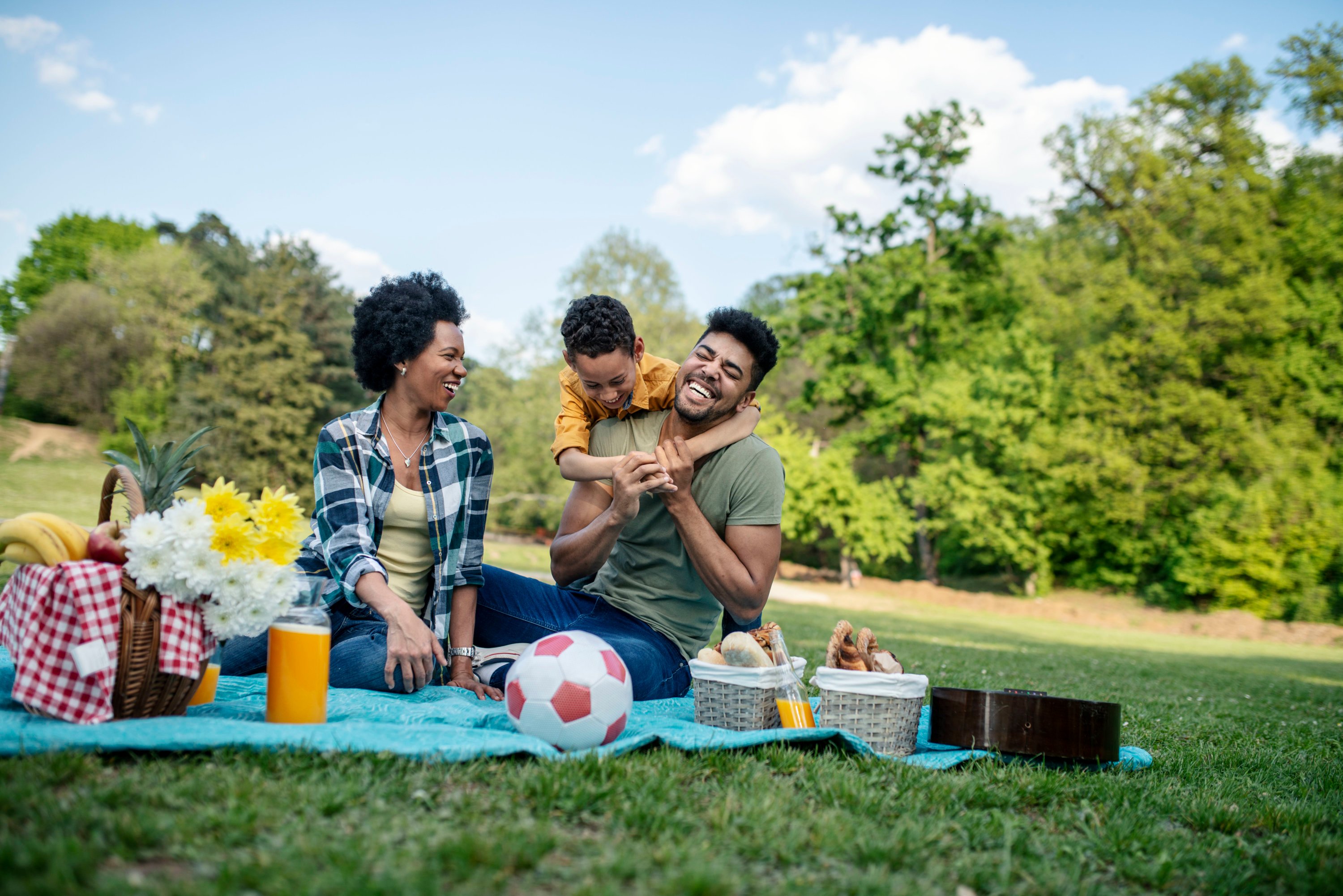 Happy family spending a spring day on picnic.