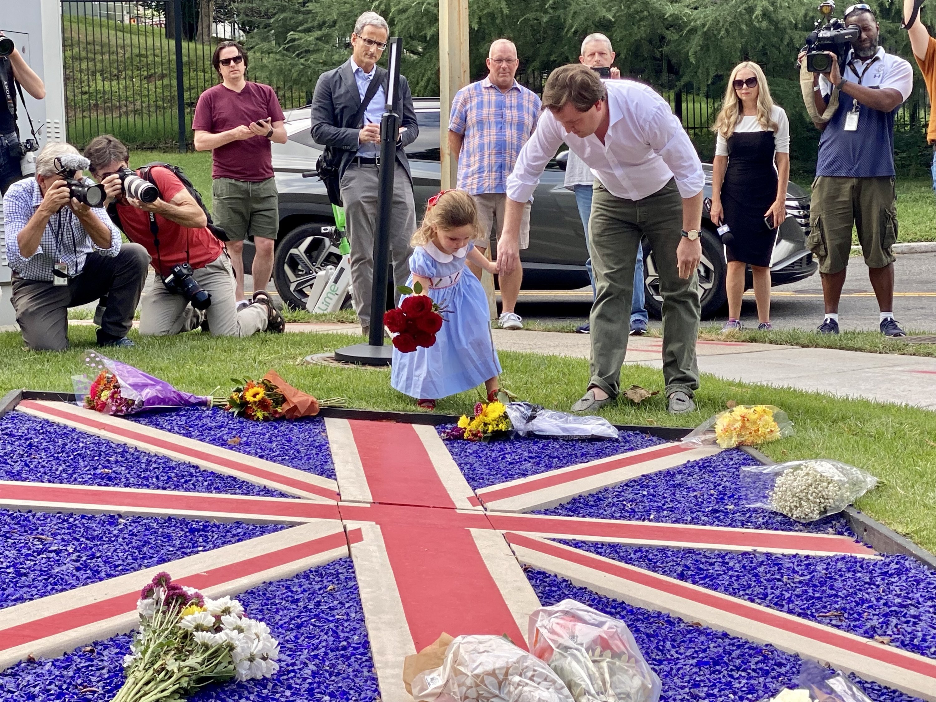 September 8: Bringing flowers to Queen Elizabeth's memorial at the British Embassy. 