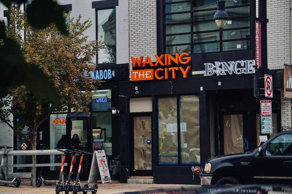 A view of a commercial building under construction with the sign "Binge Bar" above.