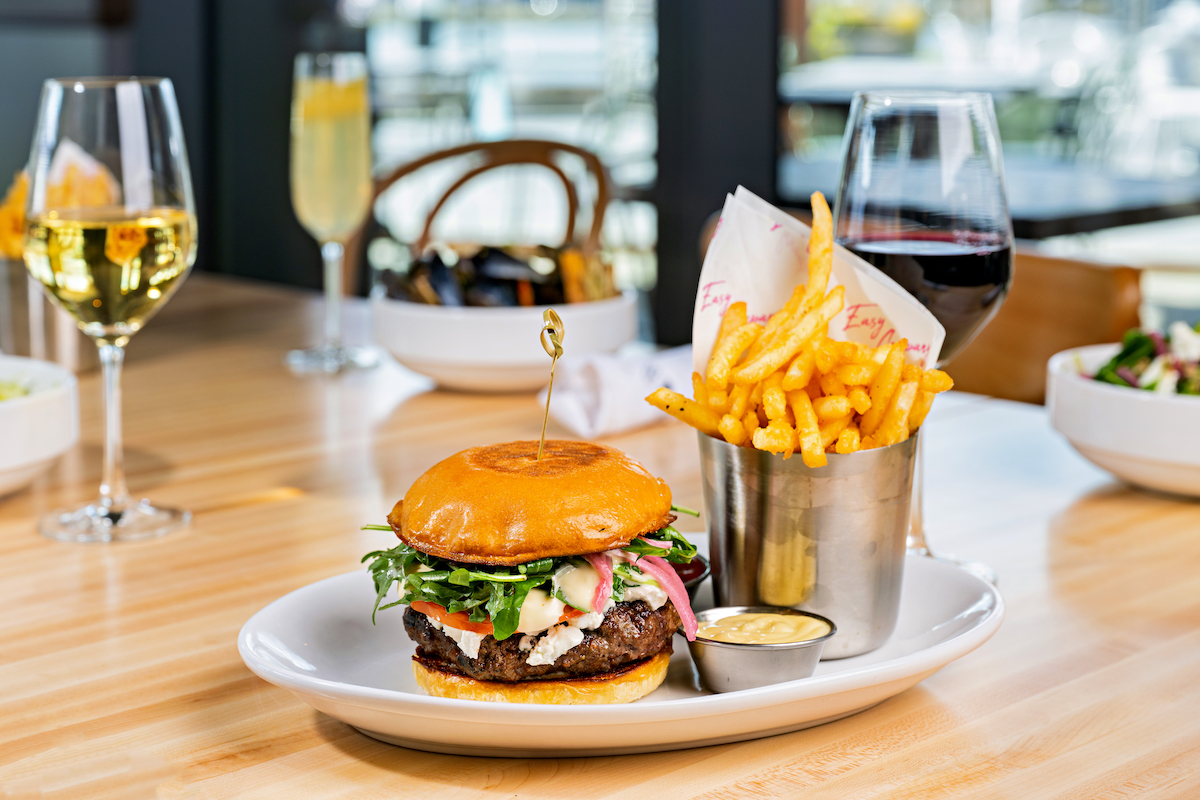 Easy Co Burger with Goat Cheese, Arugula and Roasted Garlic Aioli - Washingtonian A burger with goat cheese, arugula, and roasted garlic aioli. Photograph by Daniel Swartz