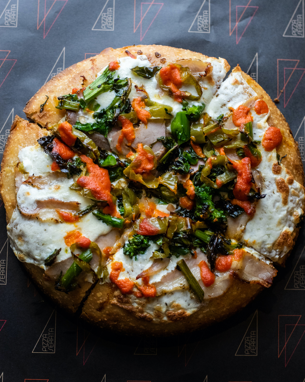 The Philly pork-inspired Reading Terminal pizza with homemade porchetta, broccoli rabe, and long hots.