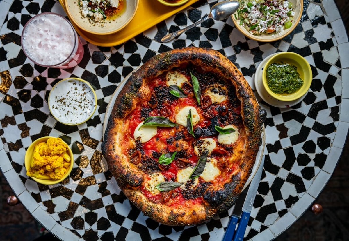 Pizzas like the margherita-inspired "Harissa Explains it All" can come with dips for dunking crusts. Photograph by Rey Lopez