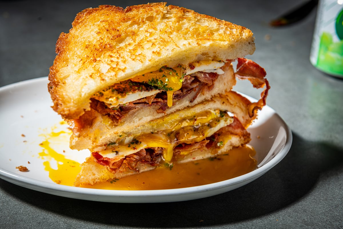 Brown butter-fried egg sandwiches come with melty cheese and breakfast meats like bacon. Photograph by Leading DC