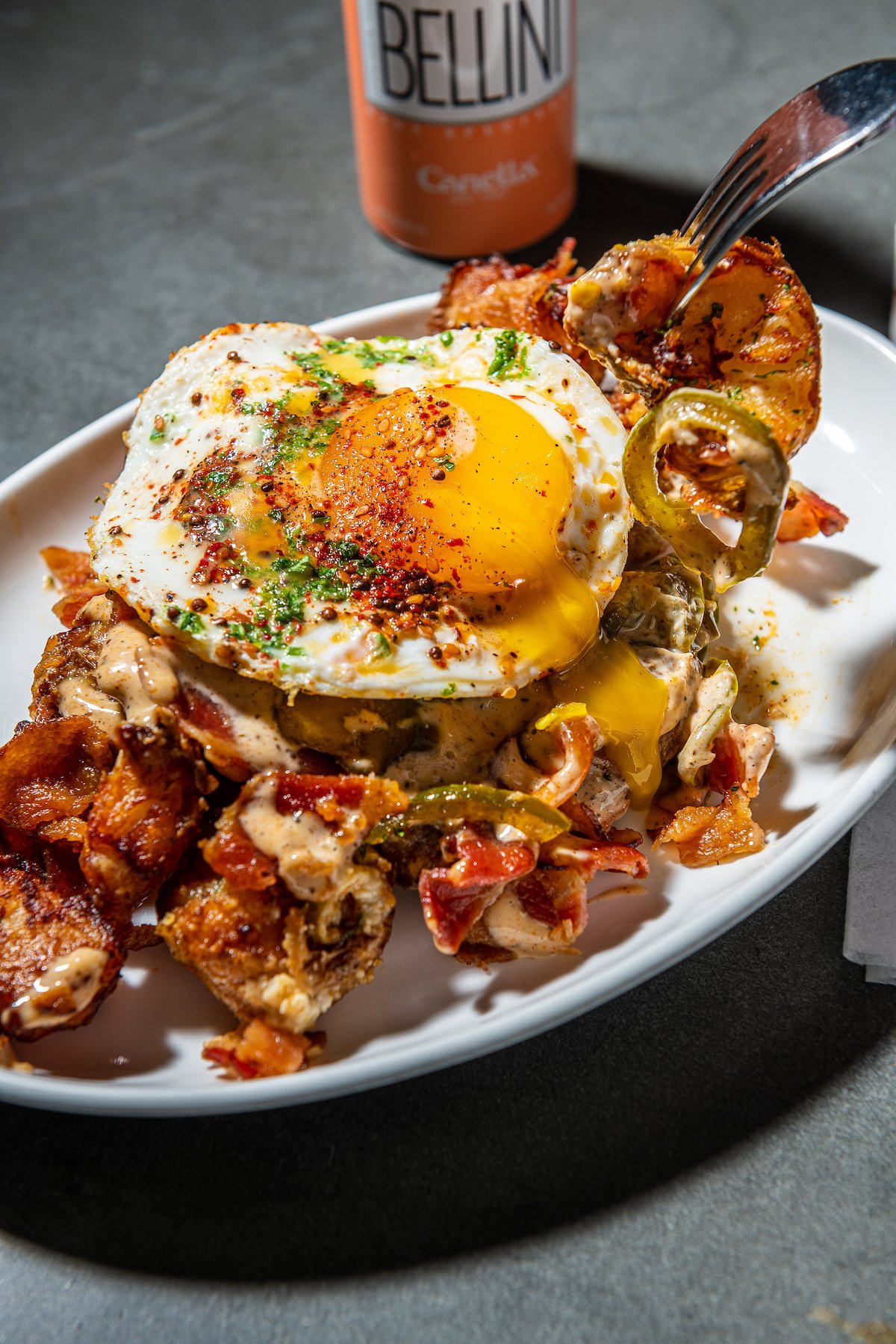 Loaded breakfast potatoes with cheese sauce and candied jalapenos. Photograph by Leading DC