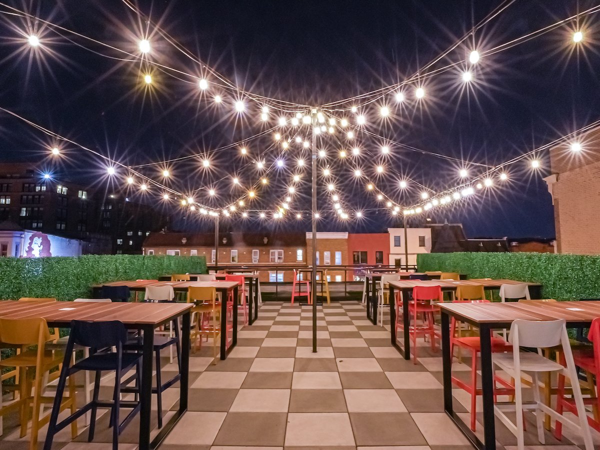 The open-air rooftop at Baja Tap is flanked by a covered bar. 