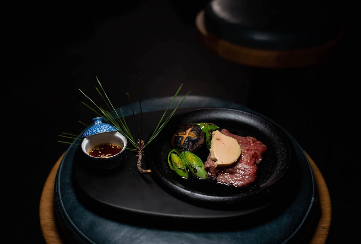 Wagyu with foie gras and charred leeks. Photograph by Kimberly Kong