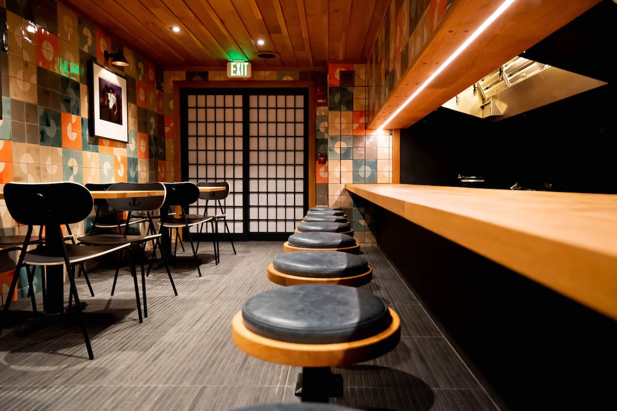 The 21-seat dining room is flanked by an open kitchen for omakase tasting. Photograph by Kimberly Kong