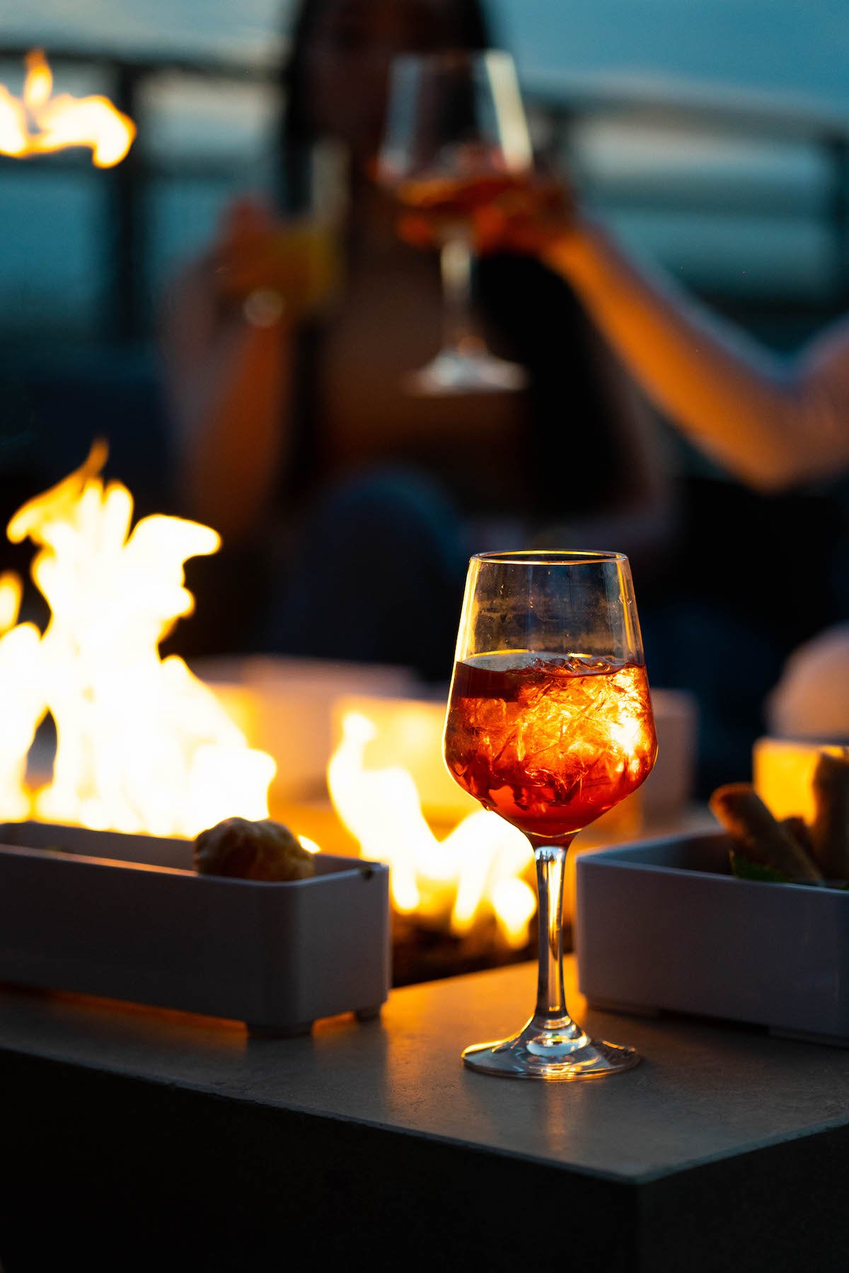 Sip cocktails by fire pits at Upstairs at the Morrow. Photograph courtesy of the Morrow. 