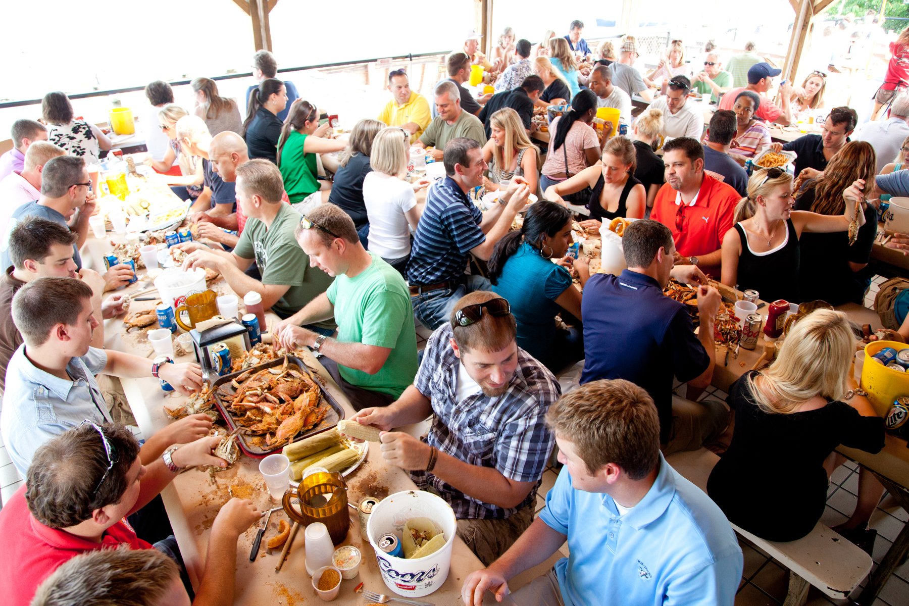 Patrons eating steamed MD Blue Crabs at Cantler's Riverside Inn, Annapolis, MD - Washingtonian