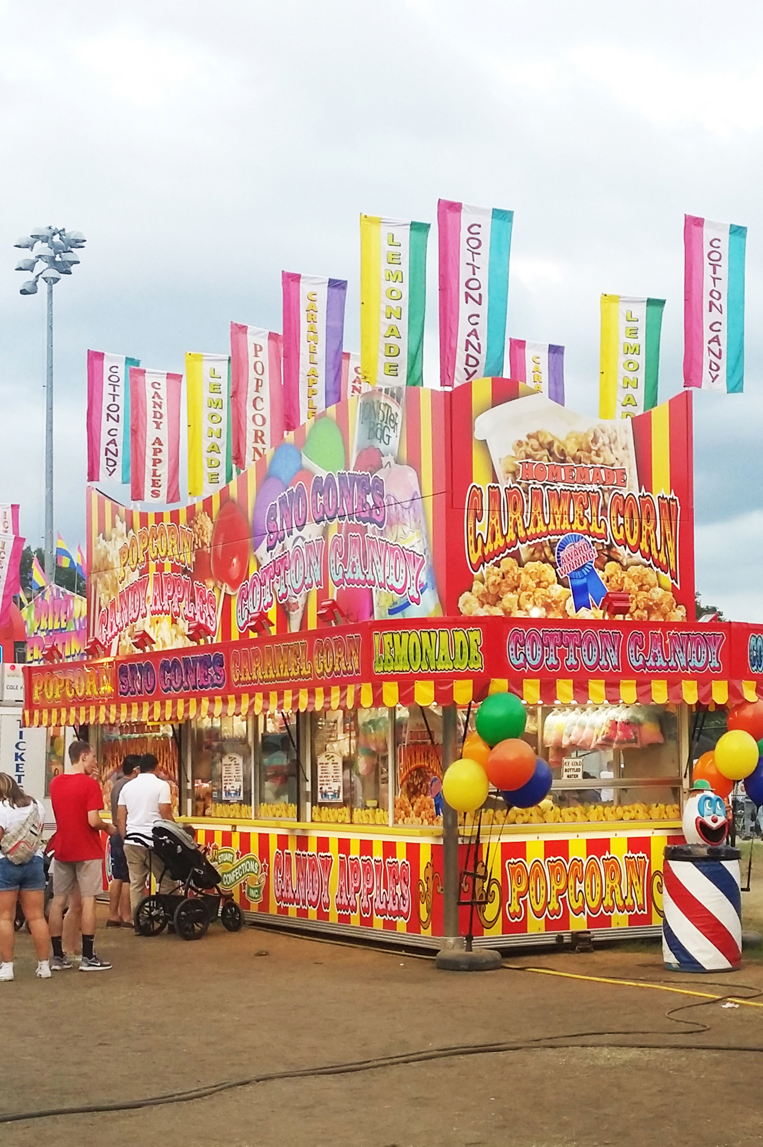 Person_eating_funnel_cake_enjoying_the_amusement_16340368019870-cropped - Washingtonian