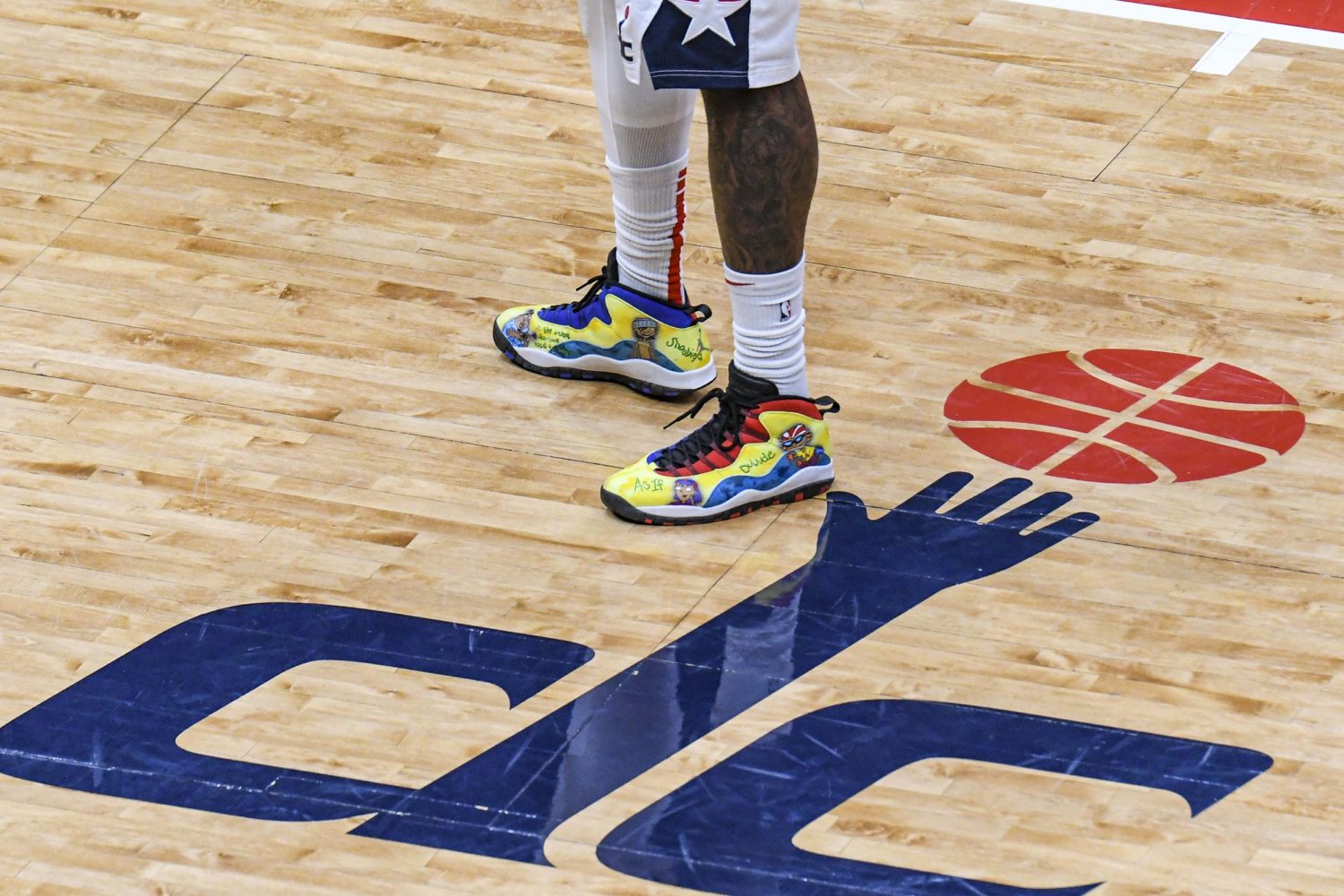 The Wizards logo on court at Capital One Arena.