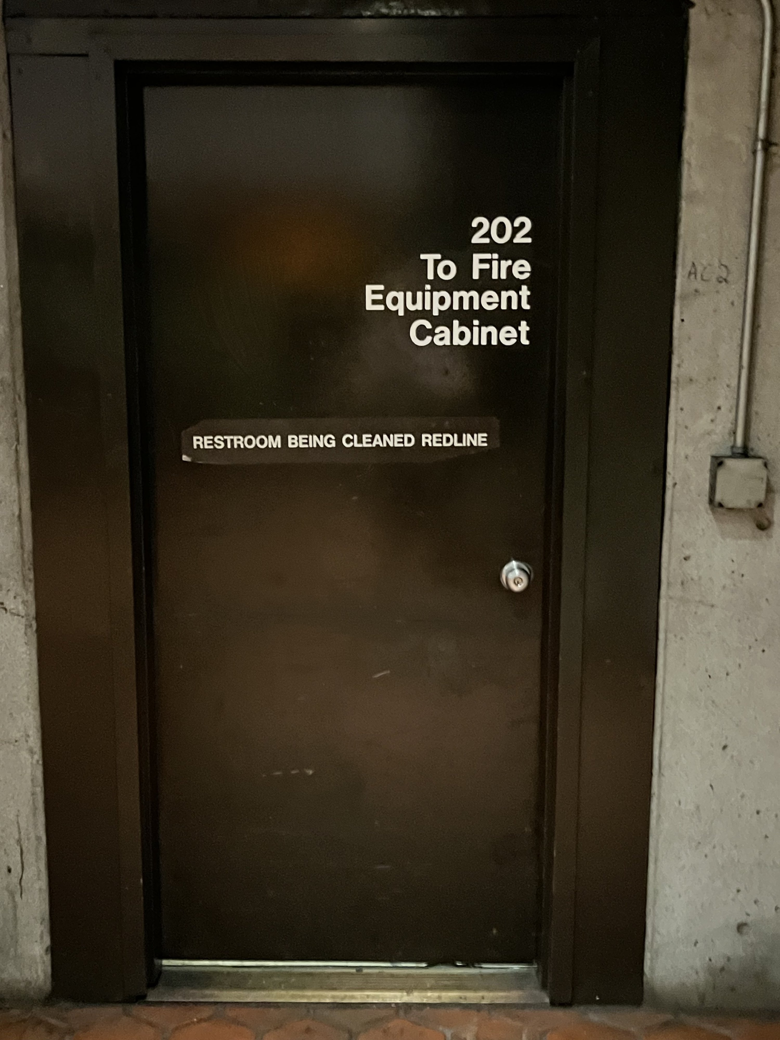 The door to the bathroom at the Van Ness WMATA station.