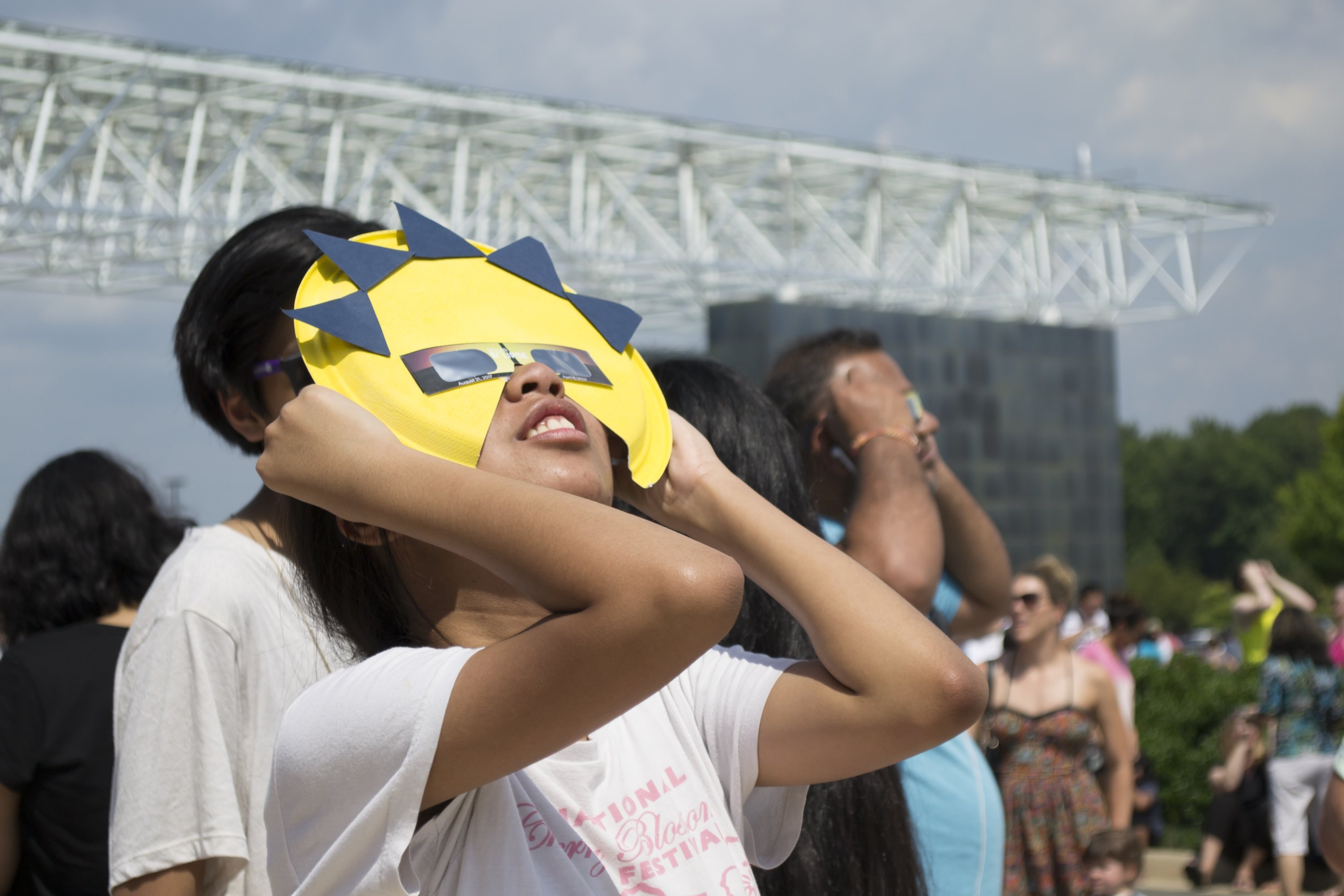 Visitors watch the solar eclipse at the Stephen F. Udvar-Haisey Center on August 21, 2017. Photo courtesy of the Smithsonian's National Air and Space Museum. 